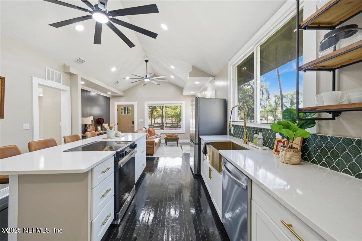 9671 Old Plank Road Jacksonville, FL 32220 - Photo 16 of 62 a kitchen with counter top space appliances and cabinets