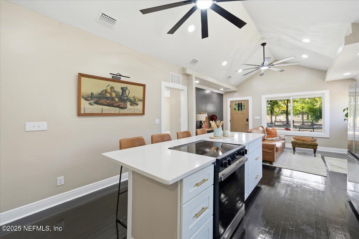 9671 Old Plank Road Jacksonville, FL 32220 - Photo 17 of 62 a kitchen with a stove and a refrigerator
