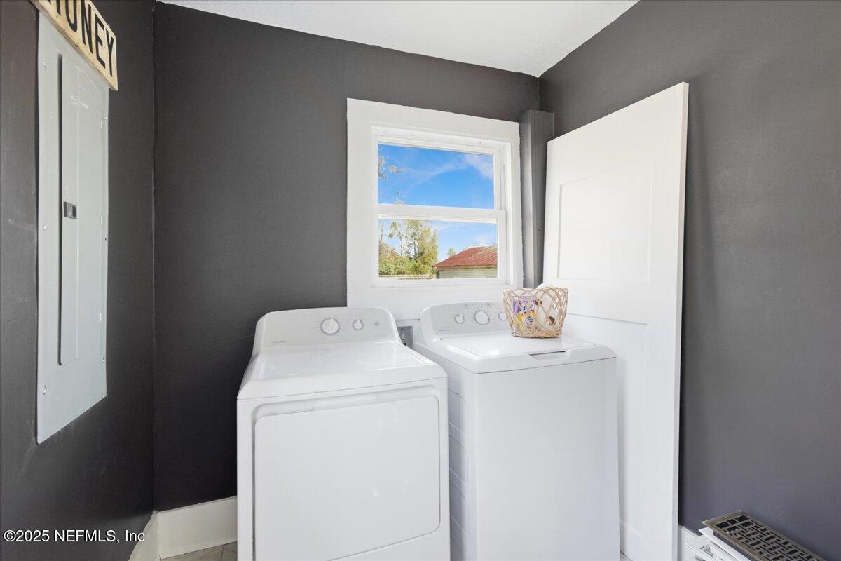 9671 Old Plank Road Jacksonville, FL 32220 - Photo 19 of 62 a utility room with dryer and washer