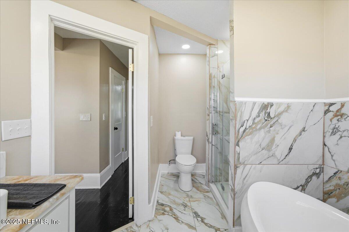 9671 Old Plank Road Jacksonville, FL 32220 - Photo 25 of 62 a bathroom with a granite countertop sink and a mirror