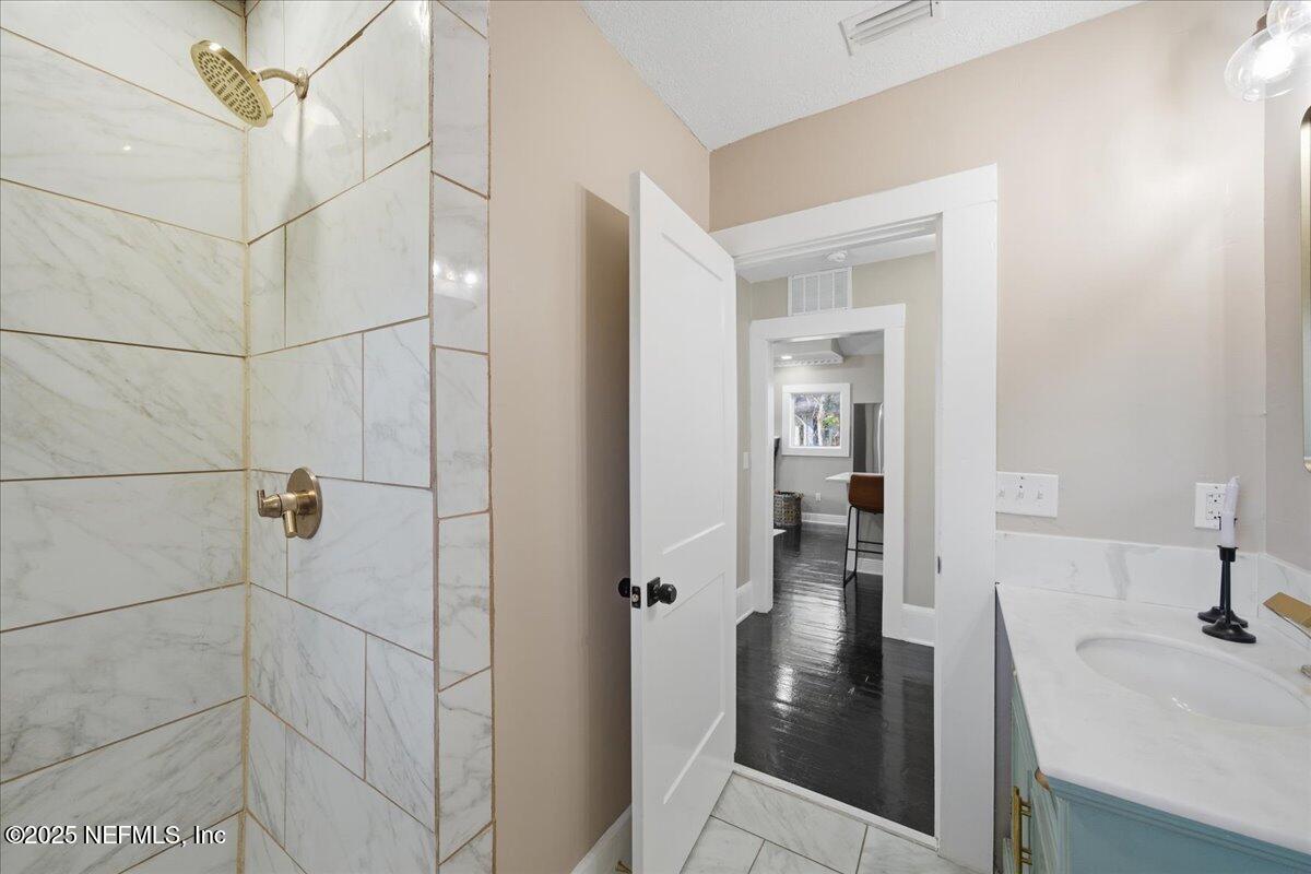 9671 Old Plank Road Jacksonville, FL 32220 - Photo 28 of 62 a bathroom with a sink and shower