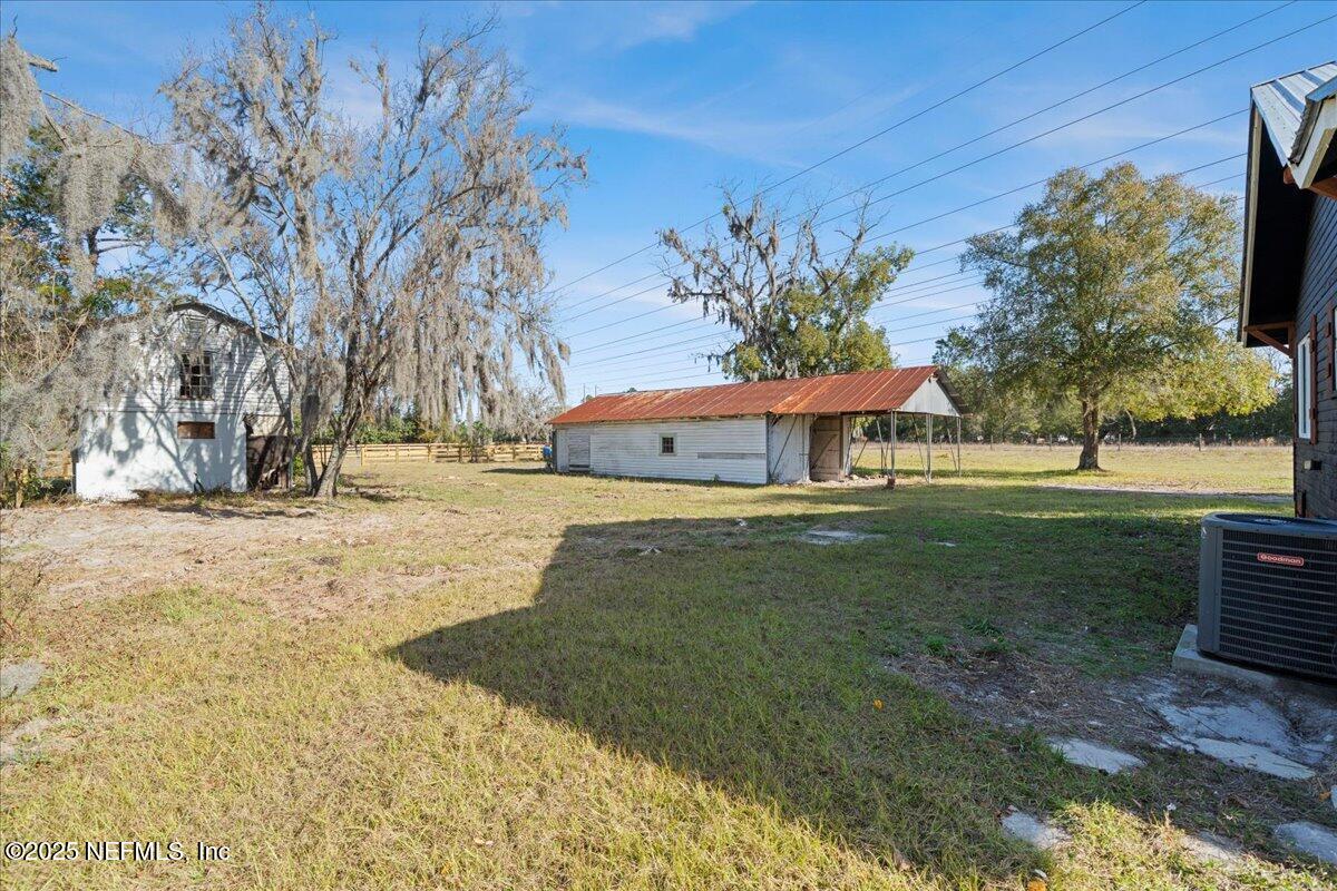 9671 Old Plank Road Jacksonville, FL 32220 - Photo 33 of 62 a front view of a house with a yard