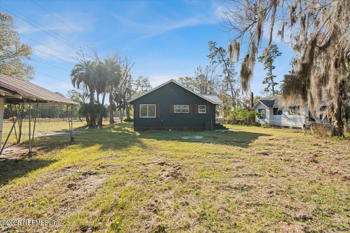 9671 Old Plank Road Jacksonville, FL 32220 - Photo 35 of 62 a view of house with backyard