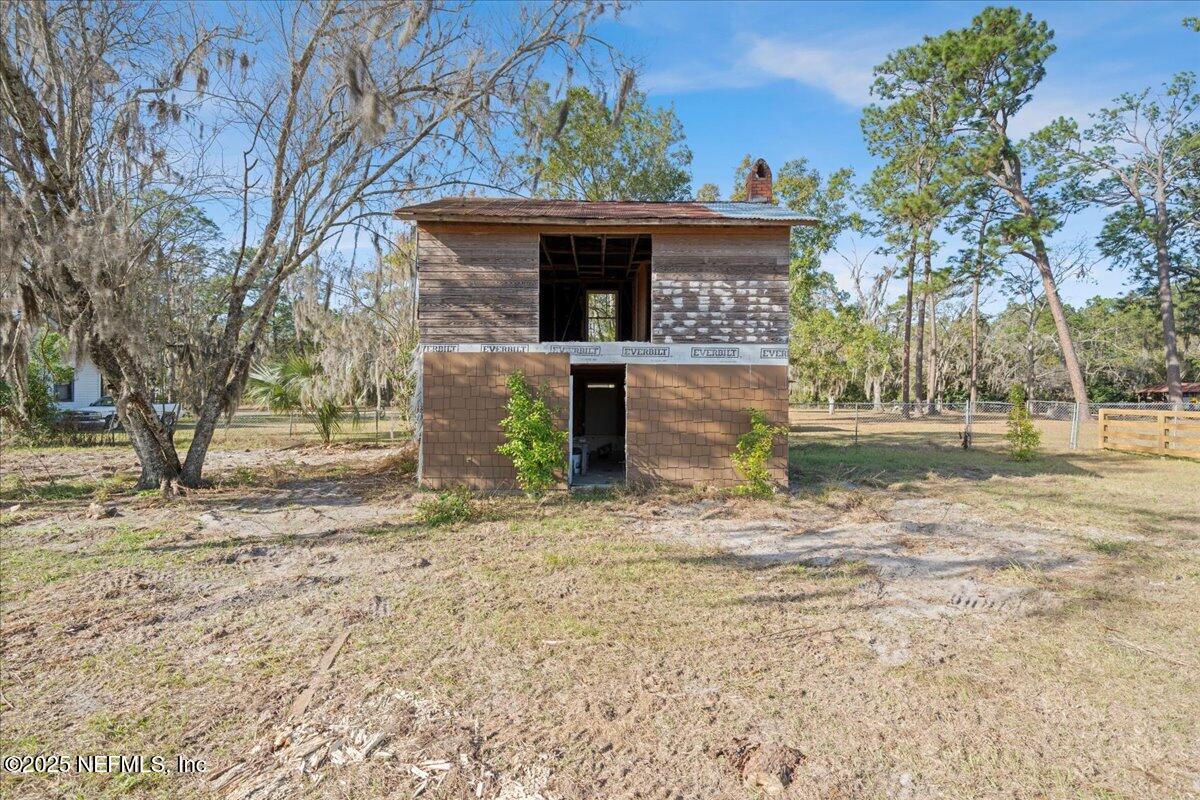9671 Old Plank Road Jacksonville, FL 32220 - Photo 38 of 62 a front view of a house with garden