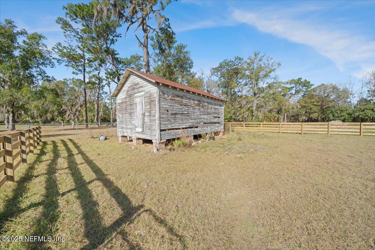 9671 Old Plank Road Jacksonville, FL 32220 - Photo 40 of 62 a view of a yard with an outdoor space
