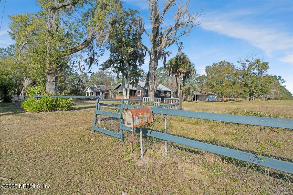 9671 Old Plank Road Jacksonville, FL 32220 - Photo 4 of 62 a backyard of a house with outdoor seating