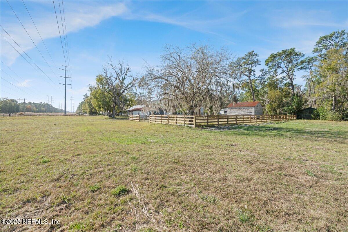 9671 Old Plank Road Jacksonville, FL 32220 - Photo 42 of 62 a view of a field with an trees
