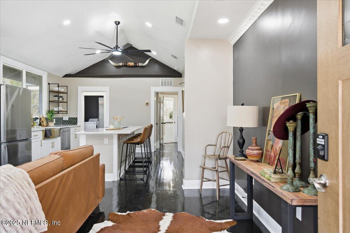 9671 Old Plank Road Jacksonville, FL 32220 - Photo 8 of 62 a view of a livingroom with furniture and a flat screen tv