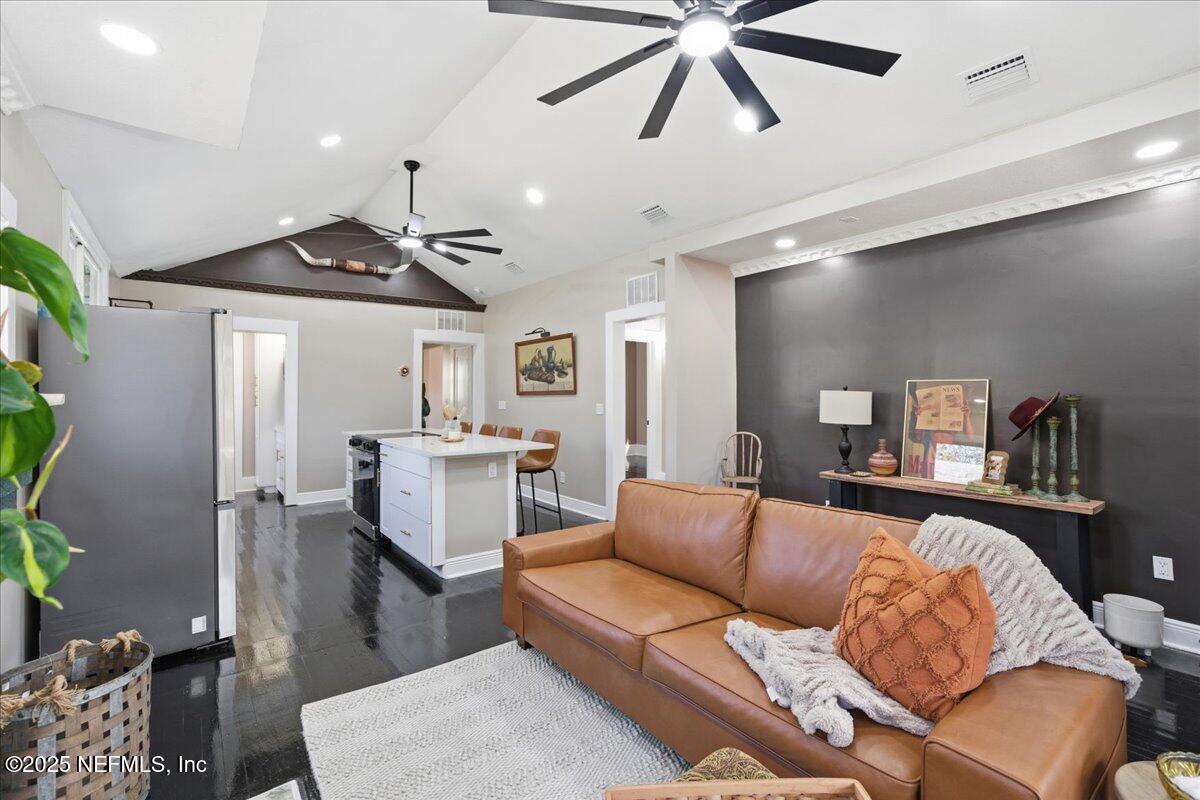 9671 Old Plank Road Jacksonville, FL 32220 - Photo 10 of 62 a living room with furniture and kitchen view