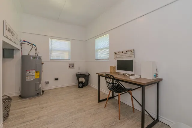 a view of a workspace with furniture