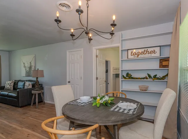 a living room with furniture and a table