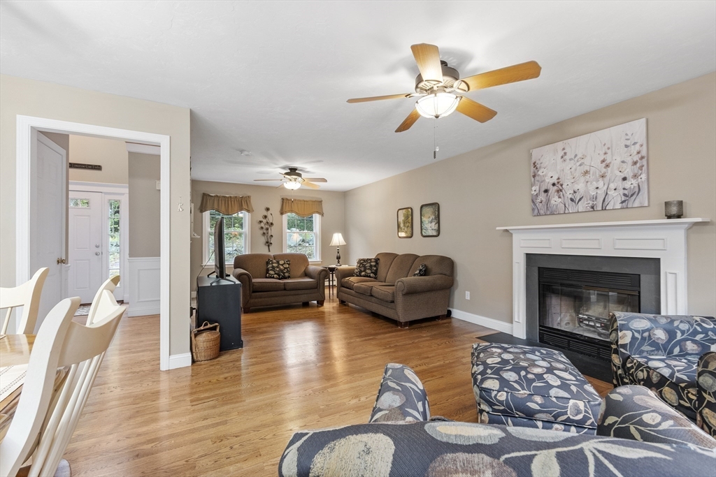 74 King Road Charlton, MA 01507 - Photo 11 of 38 a living room with furniture and a fireplace