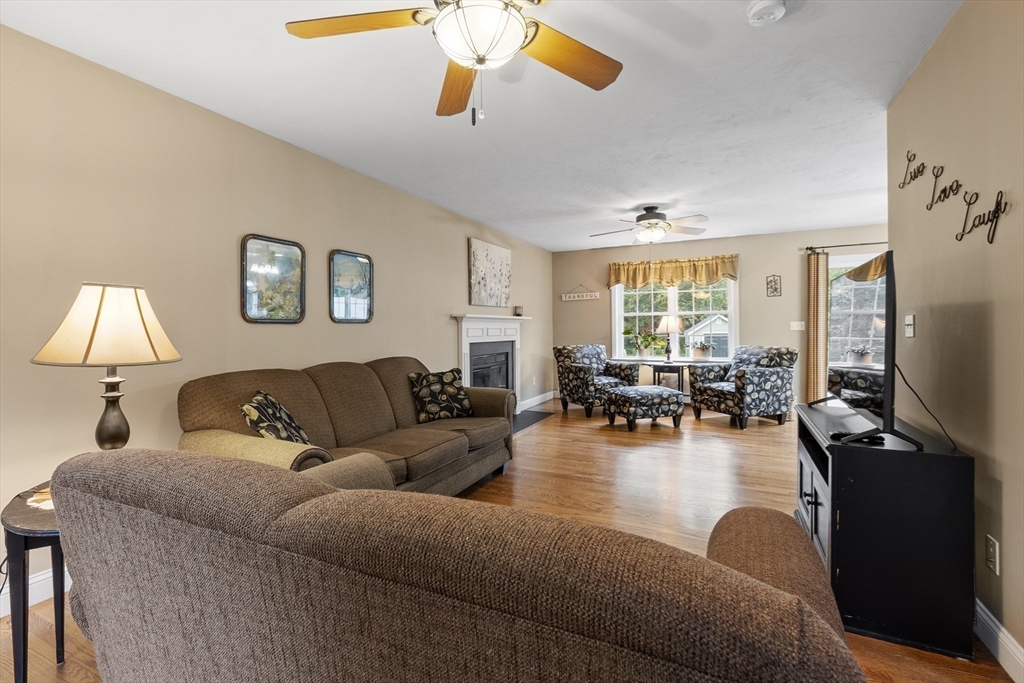 74 King Road Charlton, MA 01507 - Photo 13 of 38 a living room with furniture flat screen tv and large window