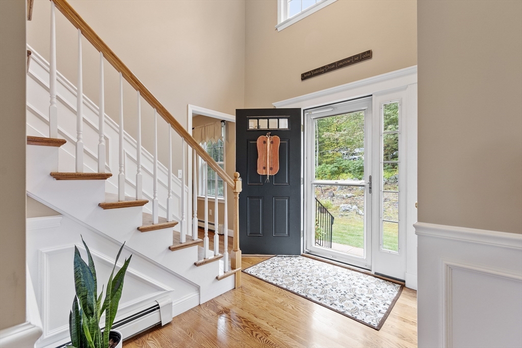 74 King Road Charlton, MA 01507 - Photo 14 of 38 a view of an entryway with wooden floor and front door