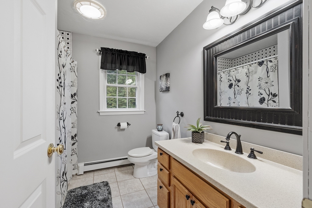 74 King Road Charlton, MA 01507 - Photo 17 of 38 a bathroom with a sink and a mirror