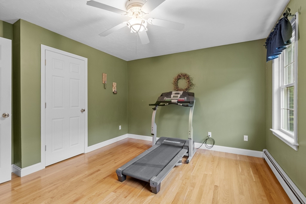 74 King Road Charlton, MA 01507 - Photo 23 of 38 wooden floor with a chandelier and a window