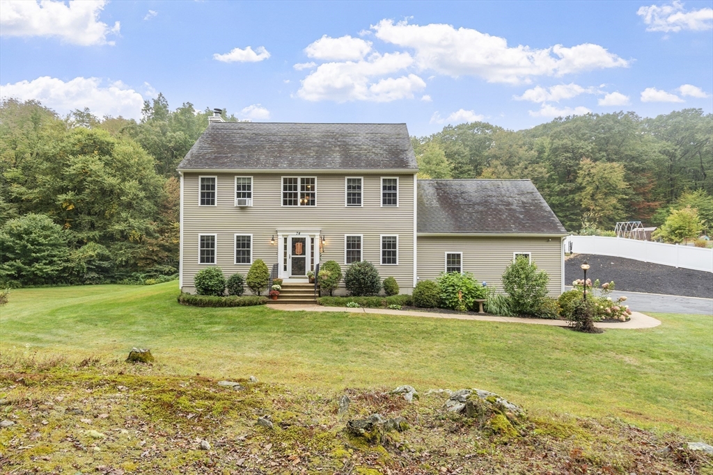 74 King Road Charlton, MA 01507 - Photo 3 of 38 a view of a house with a yard