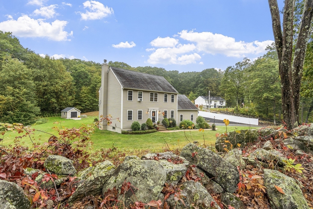 74 King Road Charlton, MA 01507 - Photo 36 of 38 a view of a house with a big yard and a large tree center
