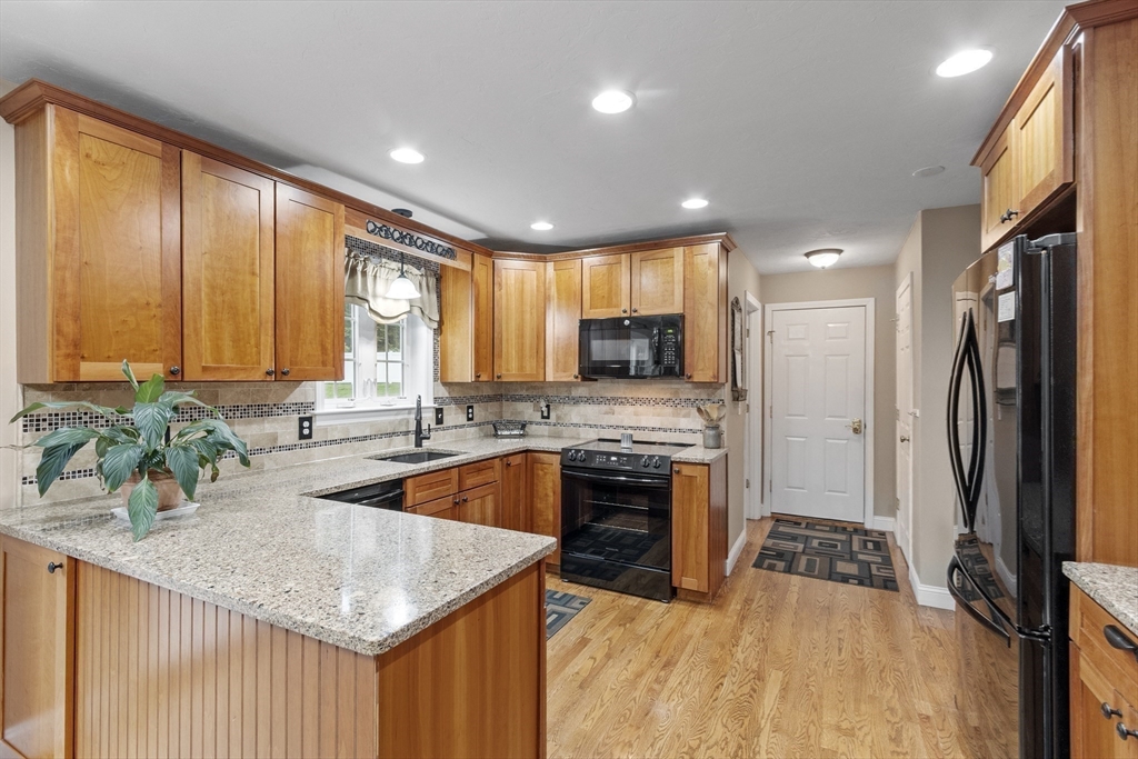 74 King Road Charlton, MA 01507 - Photo 6 of 38 a kitchen with stainless steel appliances granite countertop a sink a stove and a refrigerator