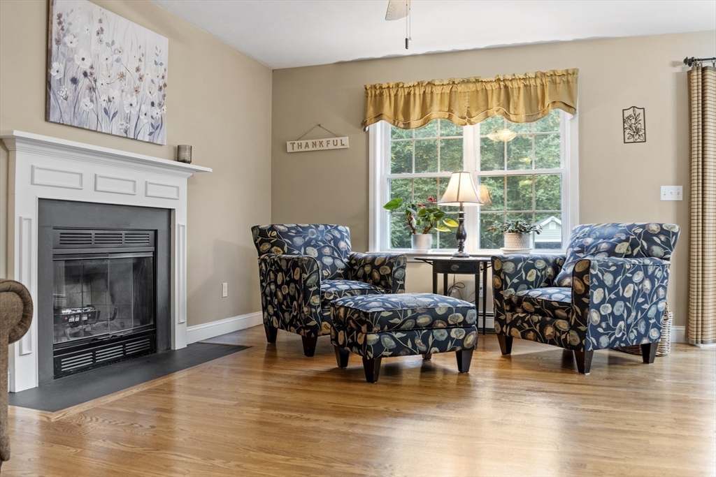 74 King Road Charlton, MA 01507 - Photo 10 of 38 a living room with furniture and a fireplace