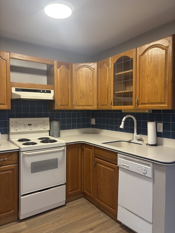 86 East Main Street Ayer, MA 01432 - Photo 22 of 35 a view of kitchen with a sink a stove a microwave and cabinets