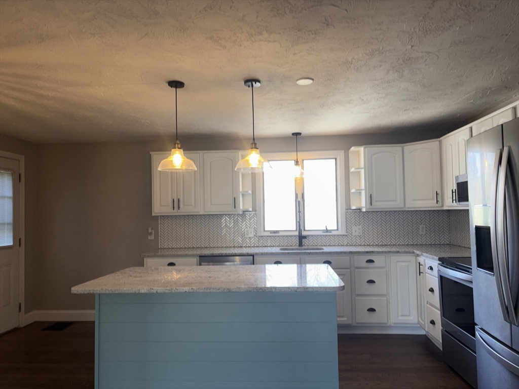 86 East Main Street Ayer, MA 01432 - Photo 3 of 35 a kitchen with a sink cabinets and window