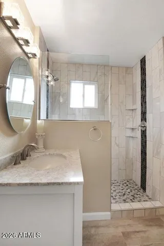 a bathroom with a sink and a mirror