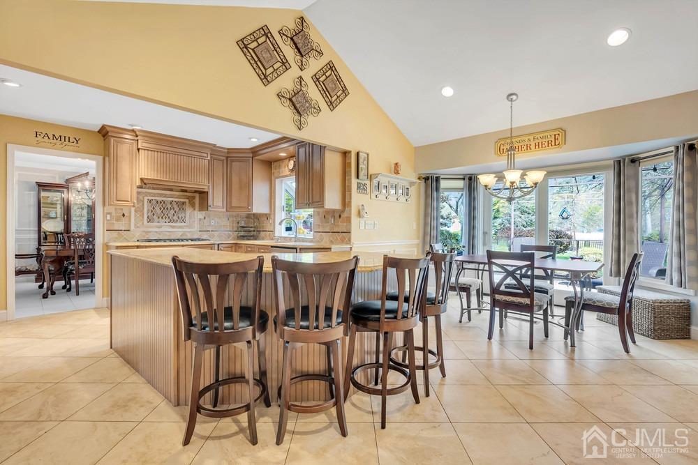 24 Crabtree Road Old Bridge, NJ 07747 - Photo 14 of 47 a dining hall with stainless steel appliances a dining table and chairs