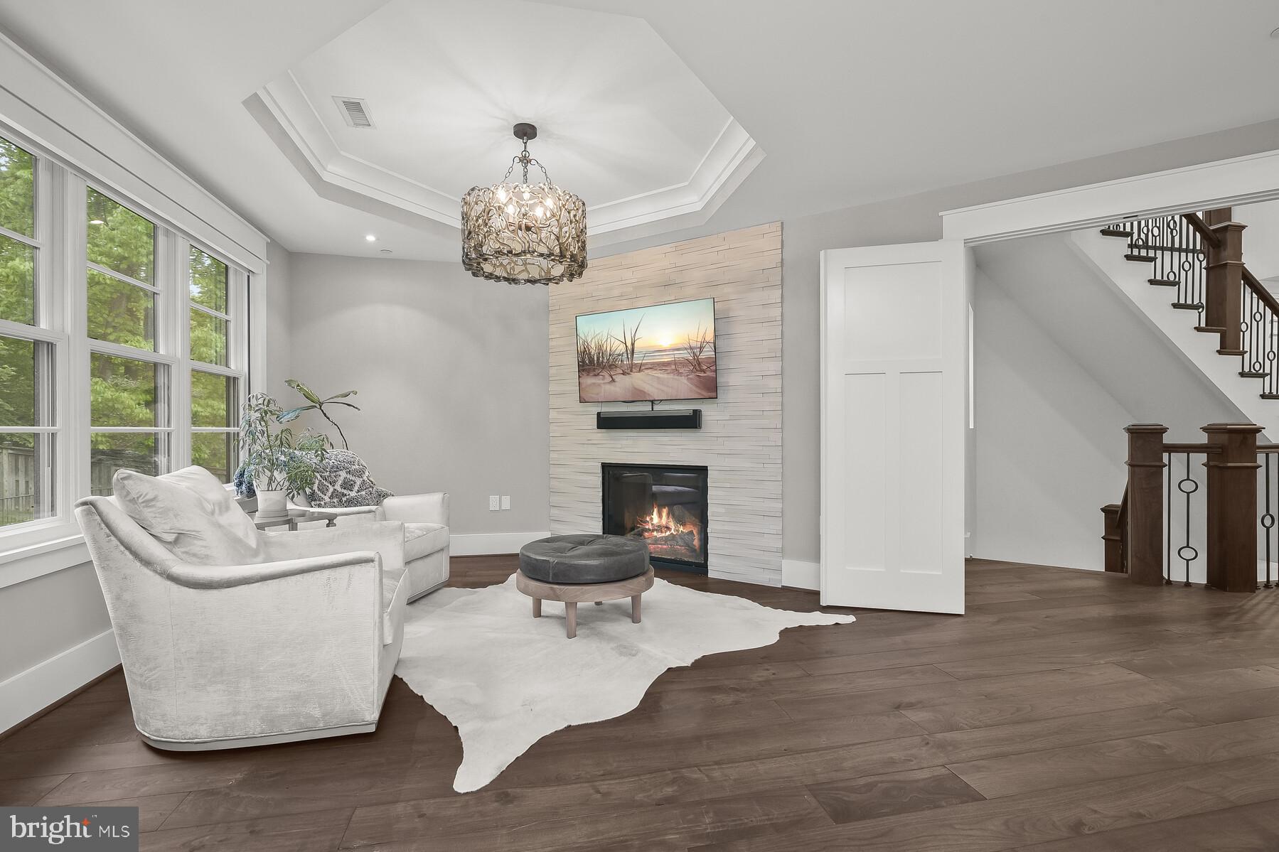 7409 Helmsdale Road Bethesda, MD 20817 - Photo 52 of 85 Primary Sitting room with TV and Fireplace
