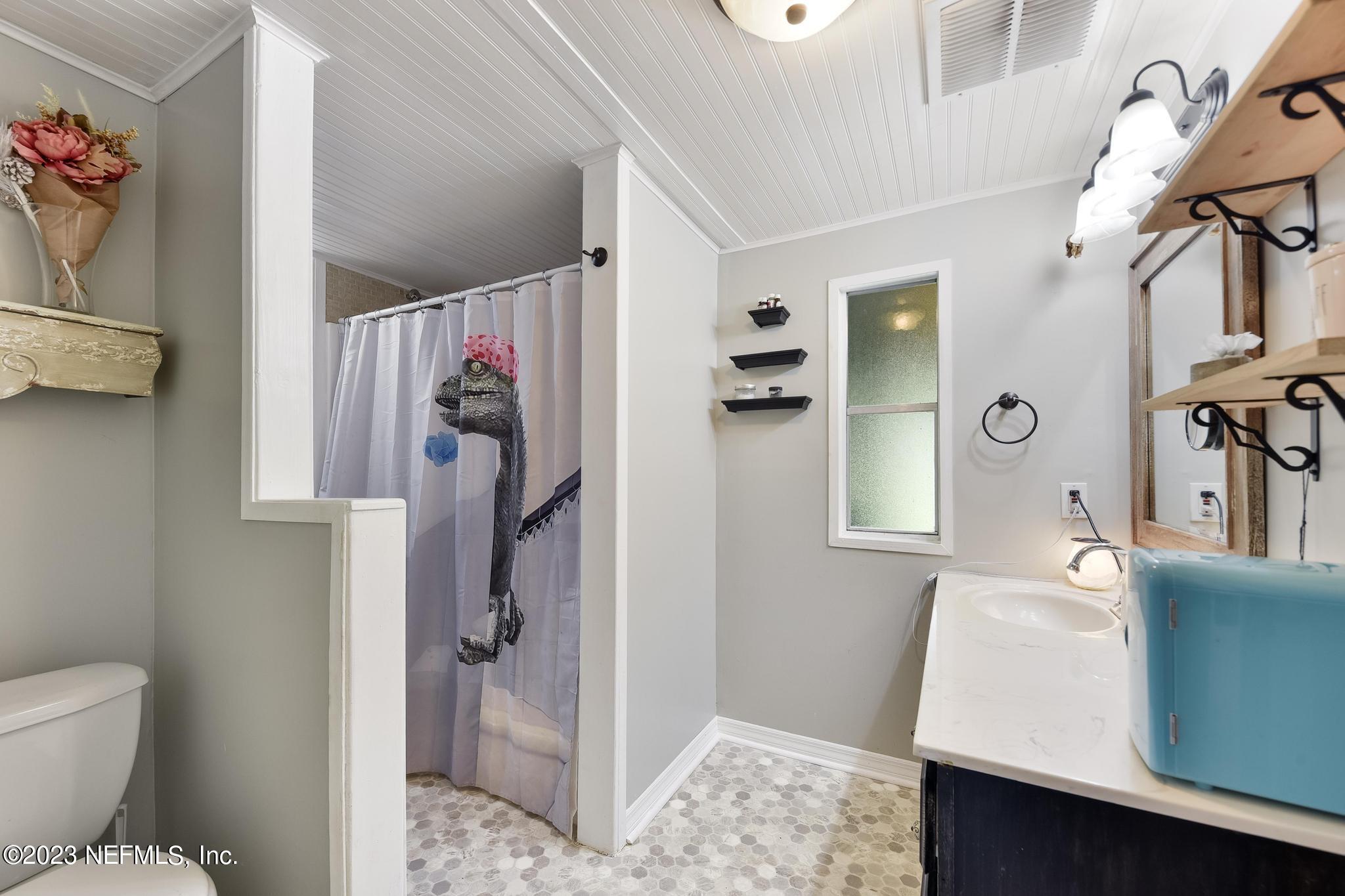 54042 Vikki Road Callahan, FL 32011 - Photo 20 of 31 a bathroom with a sink and a mirror