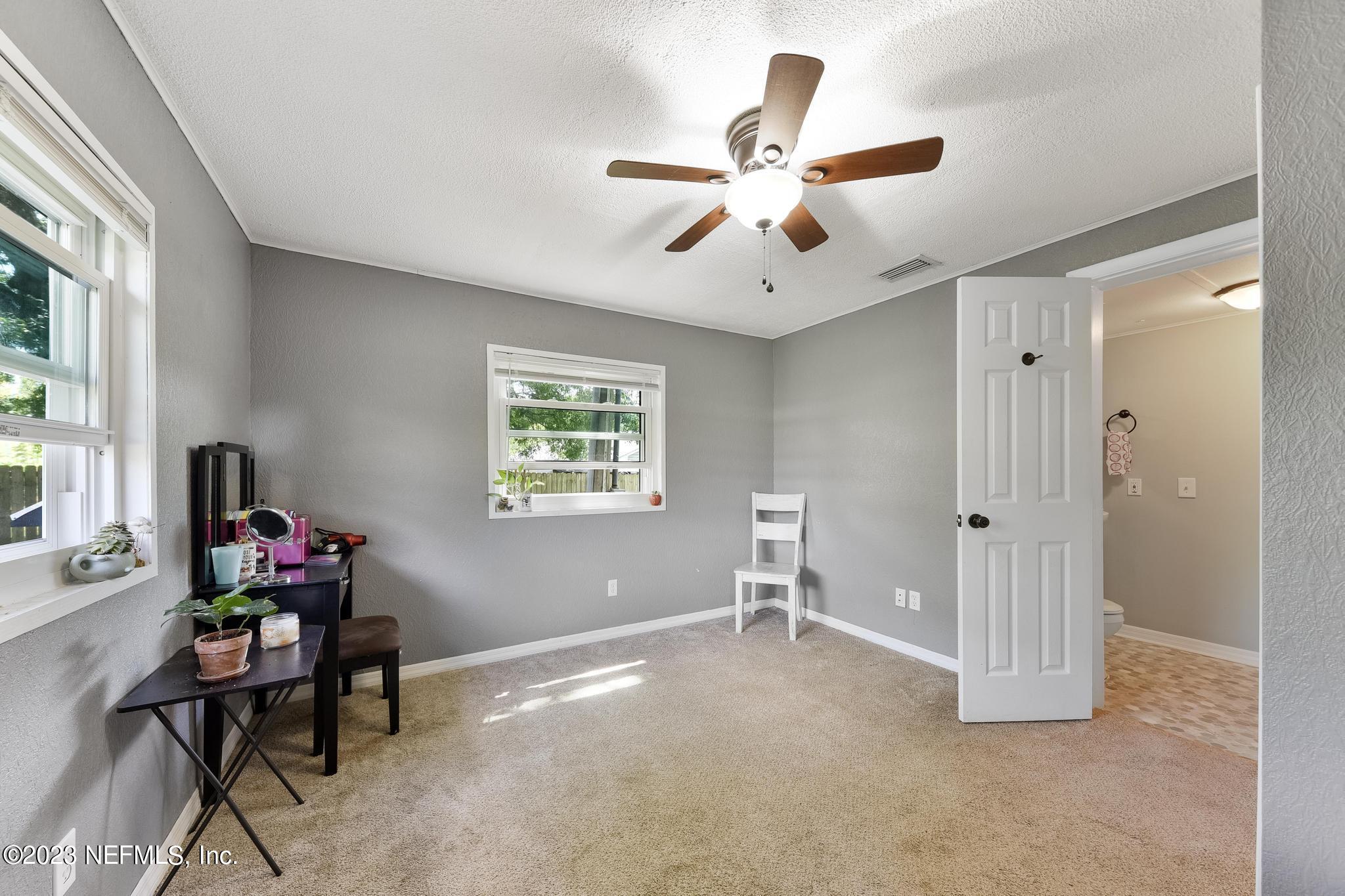 54042 Vikki Road Callahan, FL 32011 - Photo 24 of 31 a view of a livingroom with a window and workspace