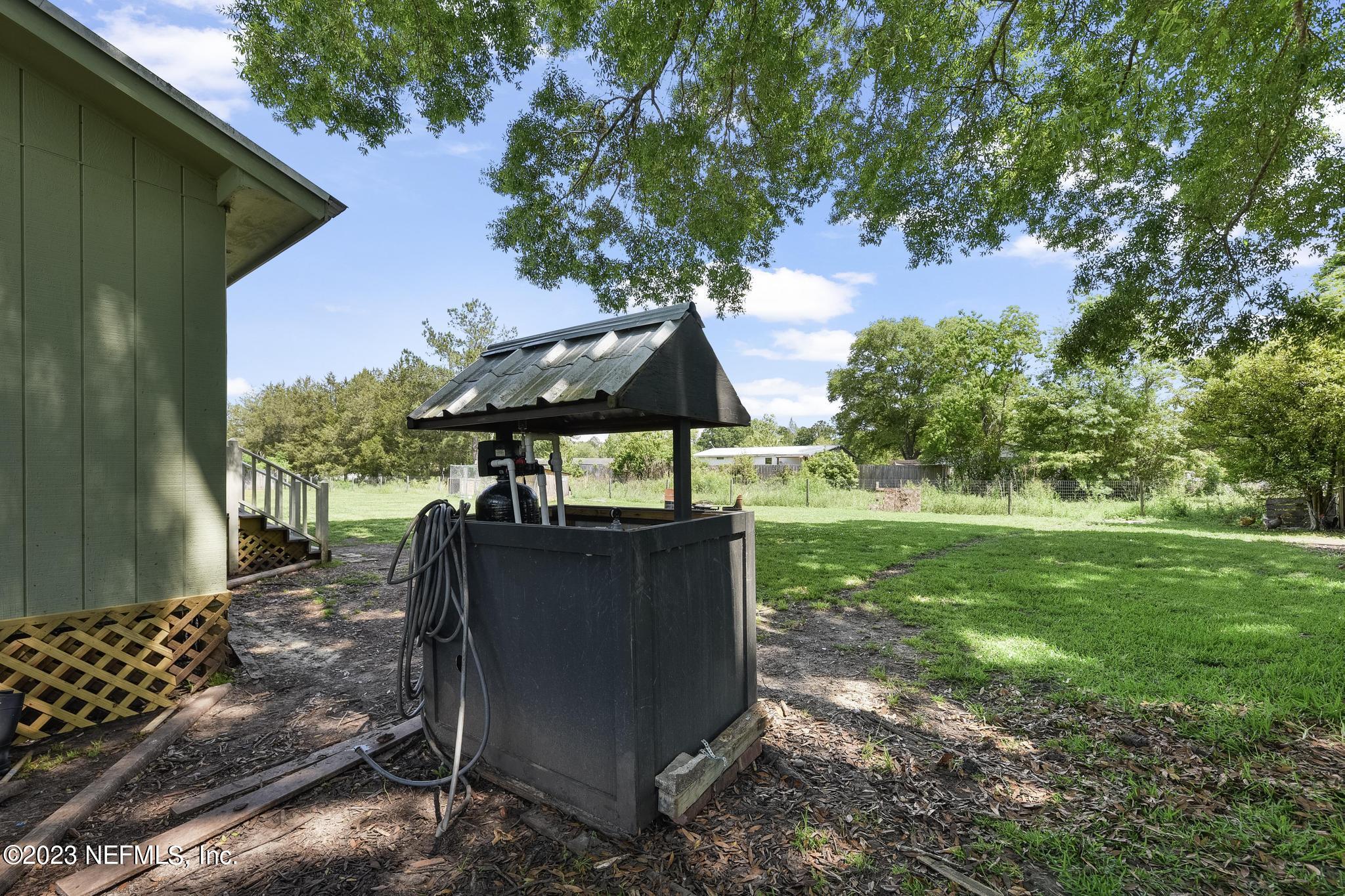 54042 Vikki Road Callahan, FL 32011 - Photo 28 of 31 a view of backyard with outdoor seating and green space
