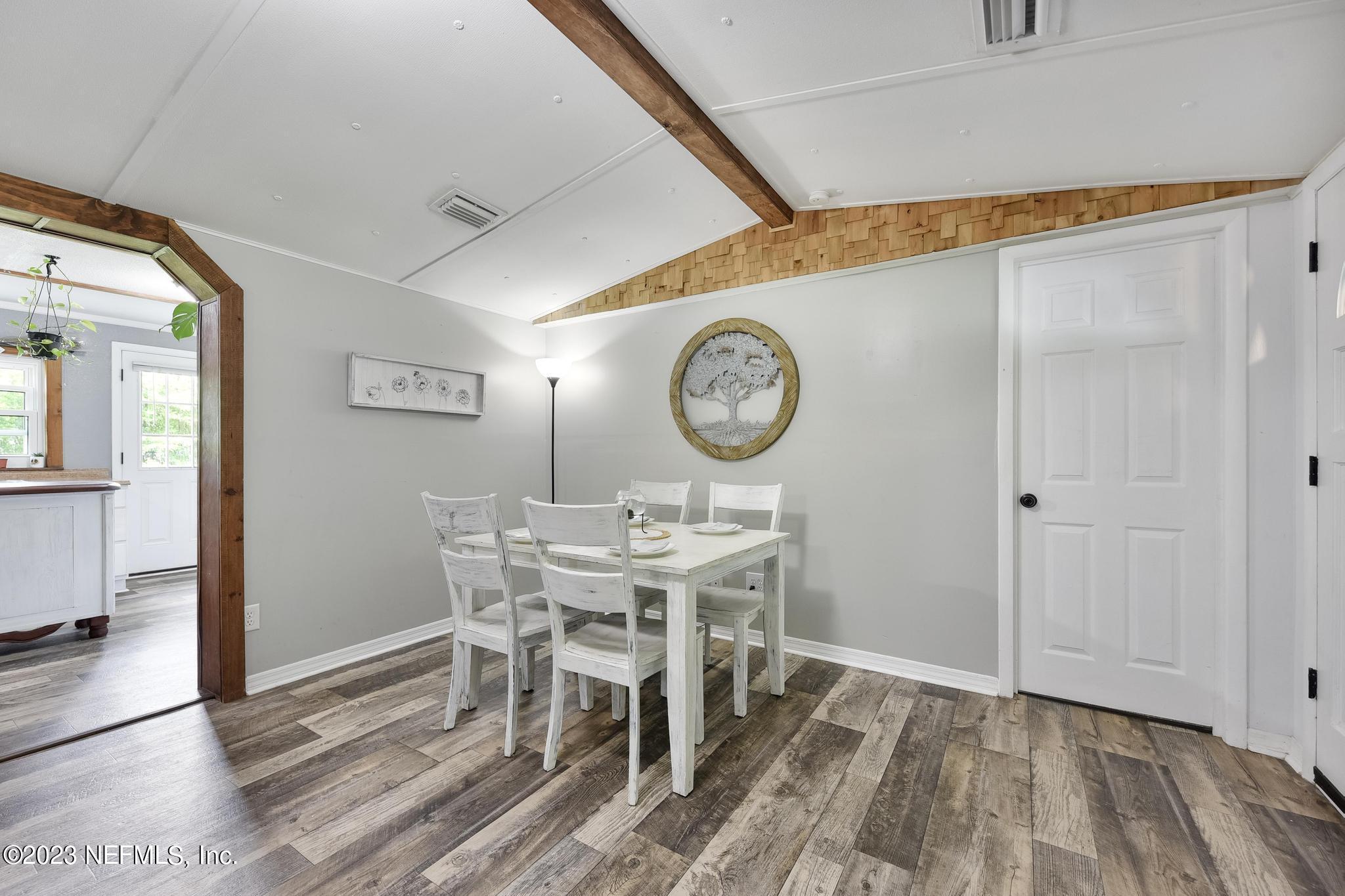 54042 Vikki Road Callahan, FL 32011 - Photo 10 of 31 a view of a dining room and kitchen with a table and chairs