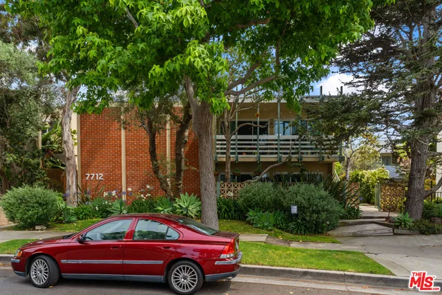 a car parked in front of a house