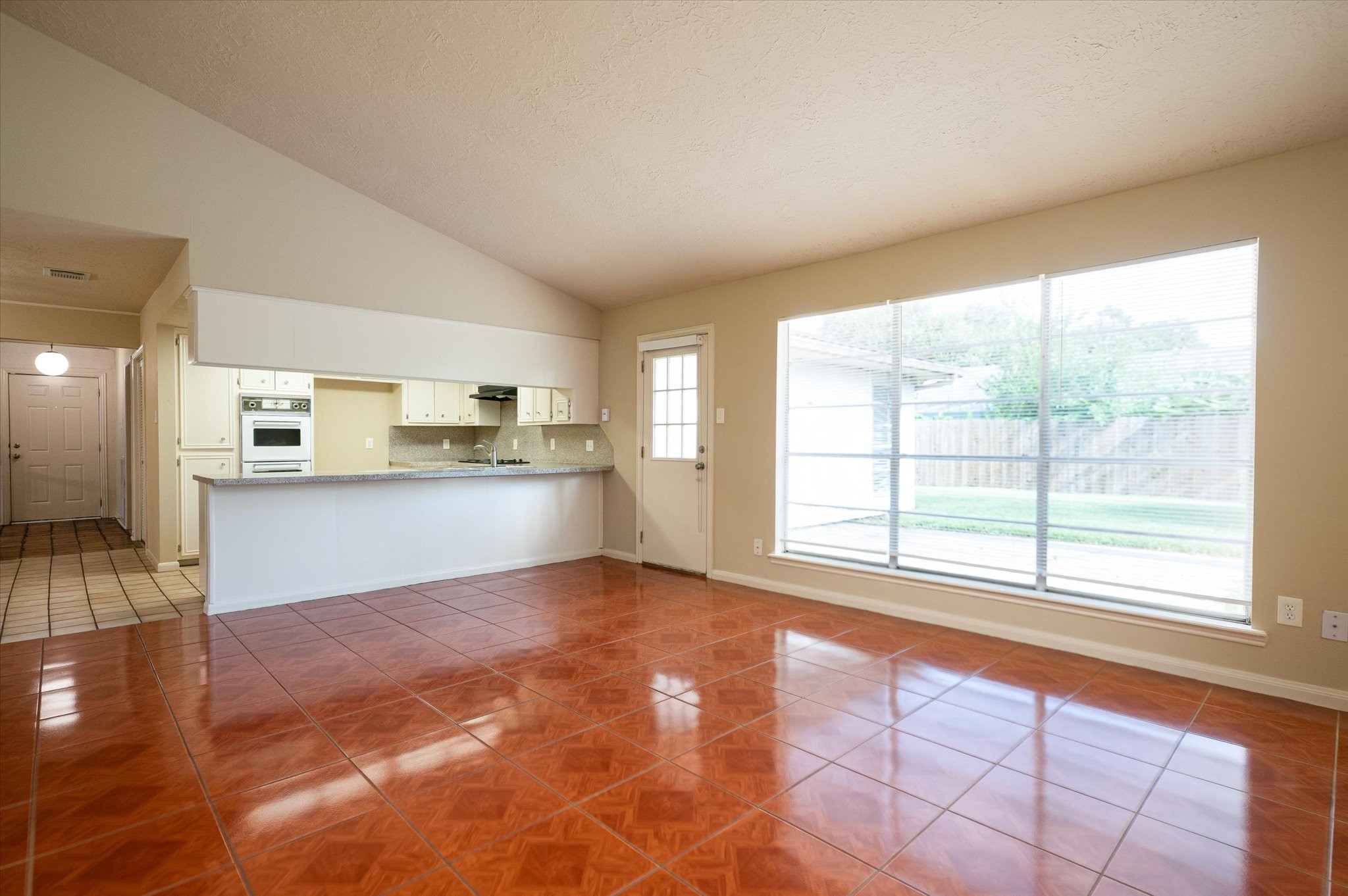 9306 Sanford Road Houston, TX 77031 - Photo 13 of 29 a view of an empty room with kitchen and a window