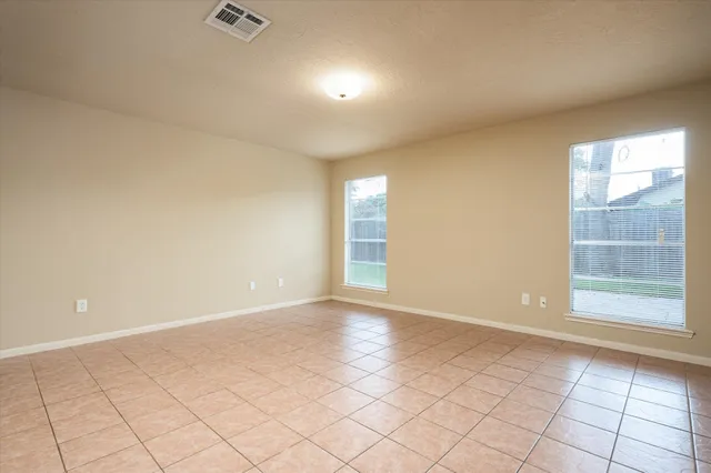 a view of a kitchen with a sink and a window