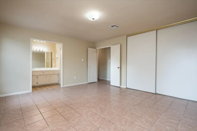 a bathroom with a sink vanity and mirror