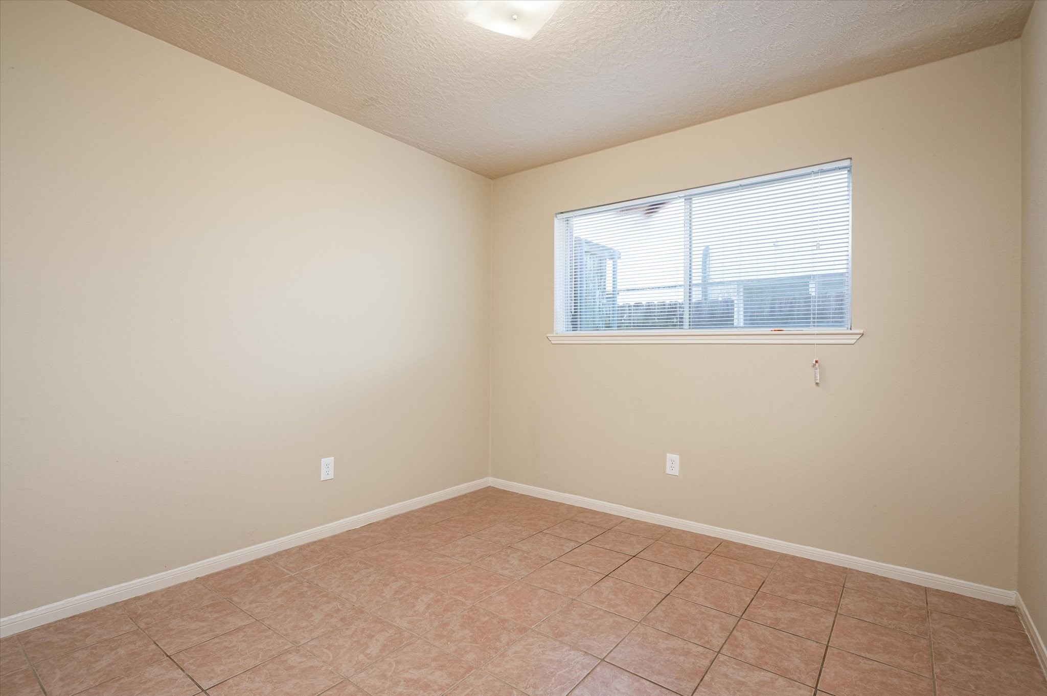 9306 Sanford Road Houston, TX 77031 - Photo 19 of 29 an empty room with a window