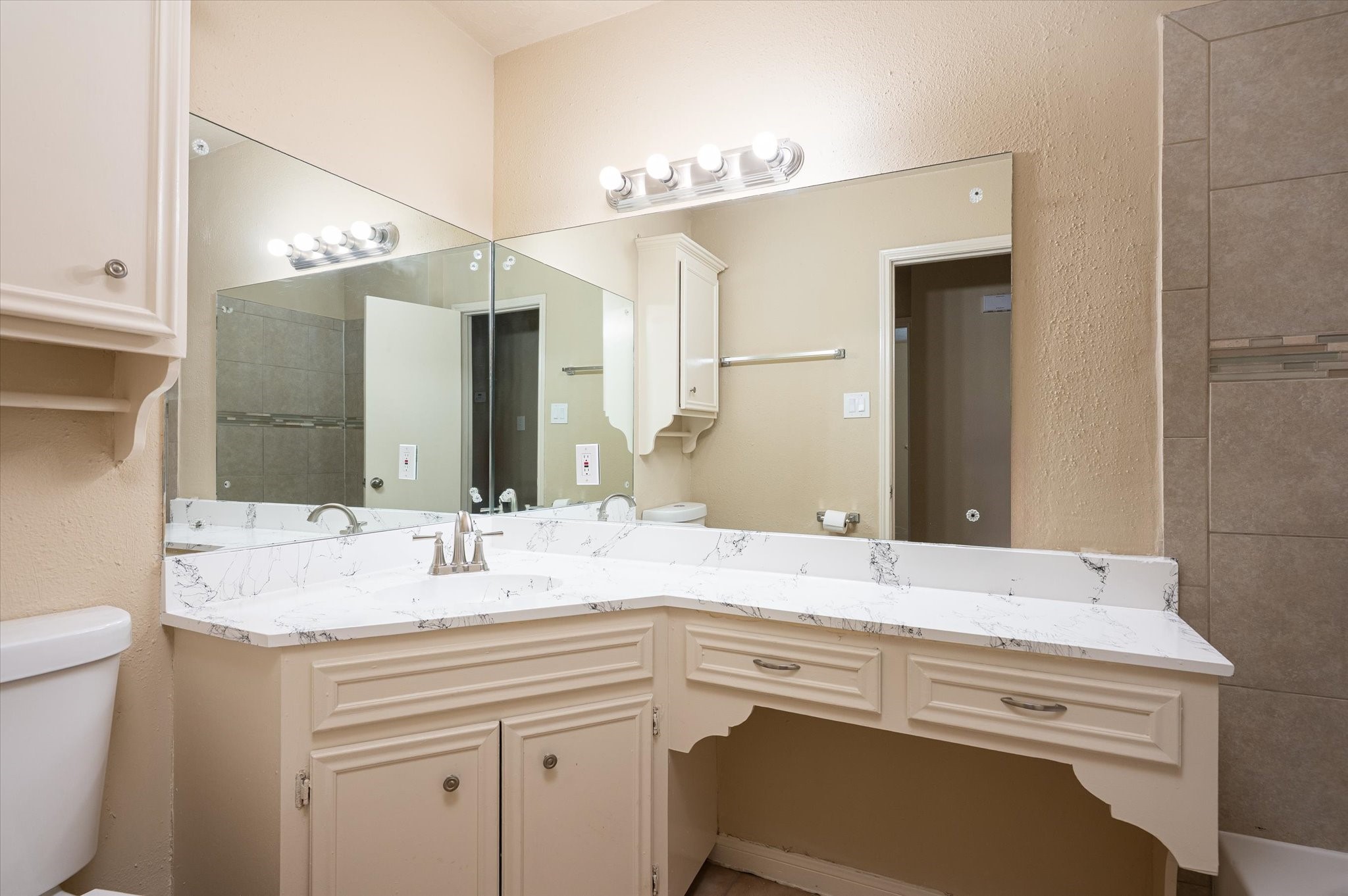 9306 Sanford Road Houston, TX 77031 - Photo 21 of 29 a bathroom with a sink and a mirror