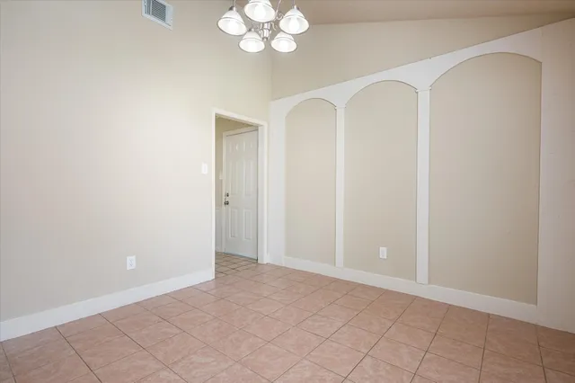 a view of kitchen with granite countertop cabinets and white appliances