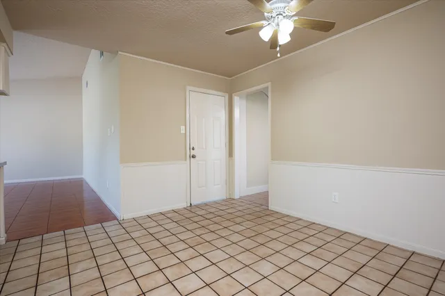 a kitchen with stainless steel appliances granite countertop a sink and dishwasher a stove top oven with white cabinets