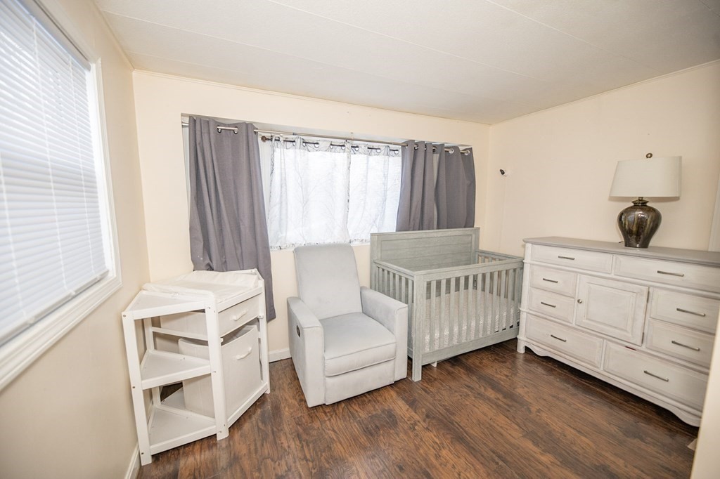 200 North Street, Unit 16C Danvers, MA 01923 - Photo 8 of 8 a bedroom with a bed and a dresser