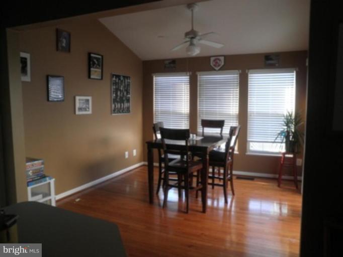 4085 Jasper Loop Dumfries, VA 22025 - Photo 2 of 15 a view of a dining room with furniture window and wooden floor
