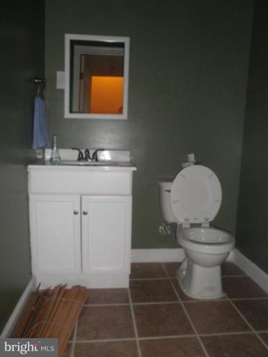 4085 Jasper Loop Dumfries, VA 22025 - Photo 13 of 15 a bathroom with a sink toilet and mirror