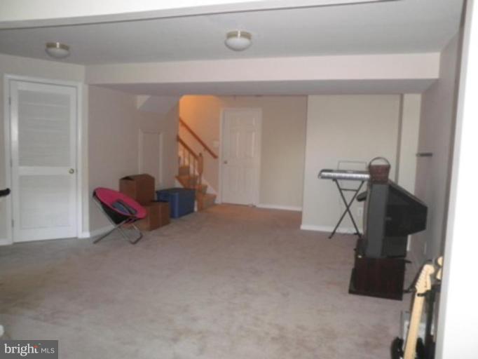 4085 Jasper Loop Dumfries, VA 22025 - Photo 14 of 15 a living room with furniture and a air conditioner vent