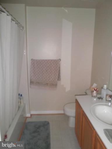 4085 Jasper Loop Dumfries, VA 22025 - Photo 5 of 15 a bathroom with a sink a toilet and shower