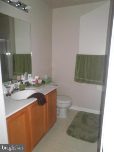 4085 Jasper Loop Dumfries, VA 22025 - Photo 7 of 15 a bathroom with a sink toilet and mirror