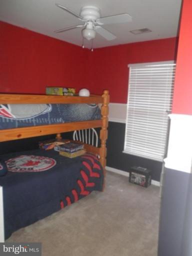 4085 Jasper Loop Dumfries, VA 22025 - Photo 10 of 15 a bedroom with a bed and a window