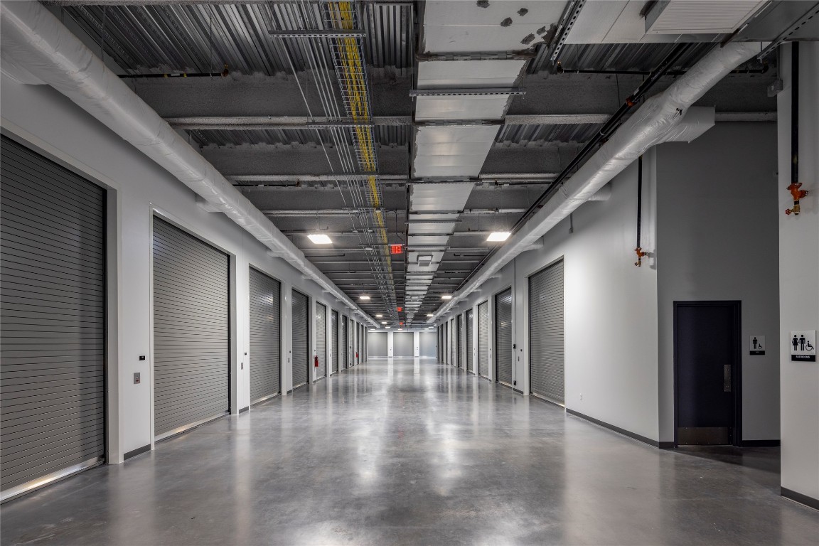 4229 North FM 620, Unit 120 Austin, TX 78734 - Photo 12 of 14 a view of hallway with stairs and wooden floor