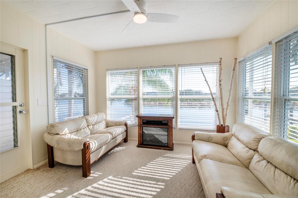 10011 110th Place, Unit 246 Largo, FL 33773 - Photo 19 of 31 a living room with furniture and a large window